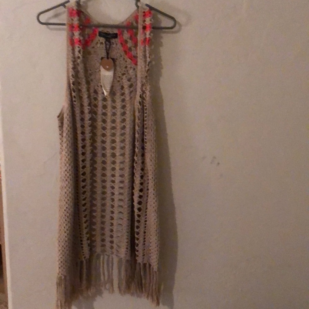 Super cute crocheted vest with fringe bottom